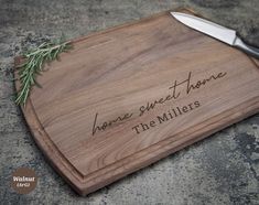 a cutting board with the words home sweet home on it