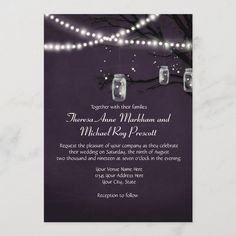 mason jars are hanging from the tree with string lights on it, and an elegant wedding card