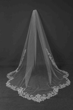 a wedding veil is shown in black and white