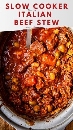 slow cooker italian beef stew in a pot with a sign above it that says slow cooker italian beef stew