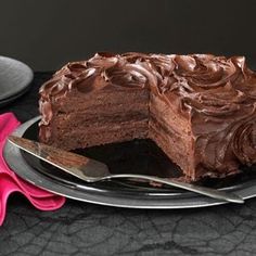 a piece of chocolate cake sitting on top of a plate