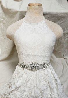 This Art Deco Beaded Wedding Belt is made with tiny silver seed beads, ivory pearls, and different shaped diamante rhinestones. The belt measures 31 inches long and 2.5 inches at it's widest. Set on a 120 inch long white or ivory satin ribbon. Everything is lined in felt so this is sturdy and won't fall apart. Like our Facebook page and receive a 10% discount when you message me before checkout! Everything made by handmade MKE is one of a kind and unique, however, if you would like a different s Embellished Silver Wedding Dress, Silver Embellished Wedding Dress, Fitted Silver Bridal Belt For Bridesmaid, Silver Embellished Bridal Accessories For Ceremony, Embellished White Bridal Belt For Ceremony, Silver Fitted Bridal Belt For Bridesmaid, White Rhinestones Bridesmaid Bridal Accessories, White Embellished Bridal Belt For Ceremony, Silver Beaded Bridal Accessories For Wedding