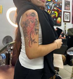 koi fish tattoo with flowers Koi Fish Tattoo For Women Arm, Flower Tattoo Arm Women, Arm Tattoos For Women Koi Fish, Big Upper Arm Tattoo, Red Ink Arm Tattoos For Women, Seasons Change Tattoo, Coi Fish Tattoos, Pisces Shoulder Tattoo, Woman Upper Arm Tattoo