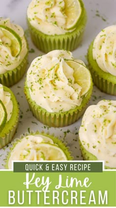 some cupcakes with white frosting and green sprinkles