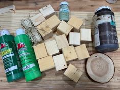 several different types of wood are laid out on a wooden table next to some glue