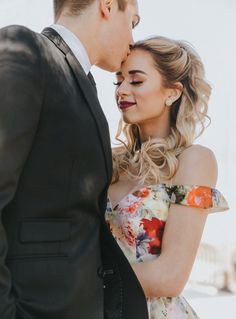 a man and woman standing next to each other