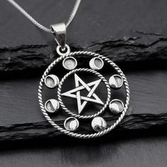 "Real 925 Sterling Silver Moon Phases Pentacle Charm Necklace This simple yet elegant necklace features a sterling silver Moon Phases Pentacle on a Dainty Sterling silver 18\" cable chain. Charm Measures 40 x 29mm Jewelry will come in a gift box * Please read shop policy before placing an order * *JEWELRY CARE* Sterling Silver will tarnish over time, but to help keep your jewelry looking beautiful - Clean with a soft dry cloth after wear and store inside an airtight bag or container. Remember to Silver Celestial Necklace 925, Silver Celestial Necklace Stamped 925, Sterling Silver Necklaces With Sun And Moon Design, Celestial Pendant Necklace Stamped 925, Mystical Moon Phase Sterling Silver Necklace, Mystical Sterling Silver Necklace, Mystical Sterling Silver Necklace In Silver, Mystical Sterling Silver Jewelry Stamped 925, Mystical Silver Necklace With Sun And Moon Design