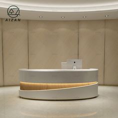 the reception desk is white and gold in color