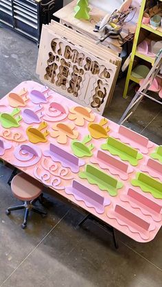 a table made out of paper with different shapes and sizes on it in a shop