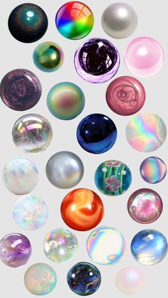 an array of glass marbles arranged in the shape of circles on a white background