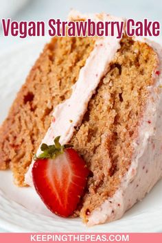 a slice of vegan strawberry cake on a white plate with a strawberry in the middle