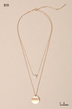 Enhance your elegance with ease by adorning yourself with the Lulus Effortlessly Ravishing Gold Pearl Pendant Layered Necklace! Shiny gold-toned metal shapes this eye-catching necklace created with two slender chains that boast a gleaming, faux pearl pendant followed by a brushed gold circle charm. Both pendants have organically-inspired designs for a unique finish. Lobster Clasp Closure. Shortest Chain Measures 15" Long With A 3" Extender Chain. Longest Chain Measures 19" Long. 75% Brass, 20% S Gold Metal Pearl Necklace With Pendant, Gold Metal Pearl Pendant Necklace, Gold Double Strand Necklace With Pearl Pendant, Elegant Gold-tone Layered Metal Necklace, Gold-tone Metal Layered Necklace With Clavicle Chain, Gold-tone Layered Clavicle Chain Necklace, Gold Metal Chain Necklace With Pearl Pendant, Gold Layered Necklace With Pearl Pendant, Gold Metal Charm Necklaces For Layering