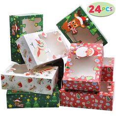 several boxes with christmas designs on them are stacked next to each other in different colors