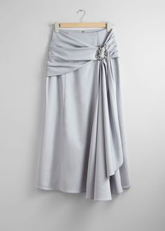 Midi skirt featuring a draped finish gathered at one side. Detailed with a silver-toned metal buckle.  • Zipper closure at the back Length of skirt: 93cm / 36.6" (EU 36 / UK 8 / US 4) Savoir is our limited collection honouring the know-how of our design ateliers with seasonal statement styles that push fashion forward. Draped Midi Skirt, Grey Drapes, Personal Values, Warrior Queen, Work Dresses, Skirt Co Ord, Knitwear Cardigan, Gray Skirt, Cardigan Jacket