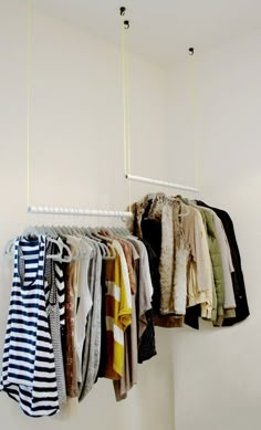 a rack with clothes hanging from it's sides