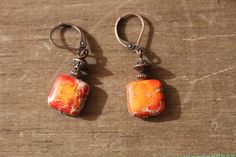 "Orange Earrings Jasper Earrings Dangle Drop Earrings Small Earrings Christmas Gift for women Color : Orange Jasper sea sediment square 10 mm Finish : Antique Copper Size : Approx 1,5 inches including the antique Copper lever back Ear wires : Antique Copper lever back Due of the nature of these beads each bead is unique...color will be slightly different for each earrings you will receive. I will always match each pairs but if you have a preference ( more yellow orange, orange brown or bright or Bohemian Orange Earrings With Natural Stones, Handmade Rust-colored Earthy Earrings, Earthy Rust-colored Earrings For Gift, Earthy Rust-colored Earrings As Gift, Rust-colored Earrings For Gift, Red Earrings Dangle, Metal Pendant Necklace, Christmas Gift For Women, Earthy Jewelry