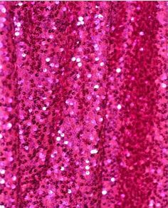 pink sequin fabric with lots of small dots on the top and bottom, as well as