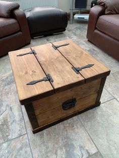 a wooden box sitting on top of a stone floor