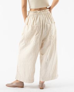 Cream Ankle Pants With Elastic Waistband, Cream Wide Leg Summer Pants, Cream Linen Pants With Pockets, Cream Wide Leg Relaxed Fit Pants, Cream Tapered Leg Summer Bottoms, Off White Linen Wide Leg Bottoms, Cream Bottoms With Pockets For Loungewear, Off White Long Pants For Summer, Off White Summer Long Pants