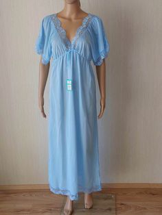 Vintage ladies light blue night gown with  lace. 100% Viscose New Old Stock With Factory Tag Textilwerke Clara Zetkin, Burgstädt Vintage girl size 45, fits like size M to L Measurements : Length: 134cm/52,7" Chest : ca 98 cm/38,5" Hips: 128 cm/50,4" It is in excellent vintage condition. New Old Stock, with Factory Tag, but please be aware, it still may have an odour of Vintage. Real colors may be little different from their appearance on your display. Light Blue Sleepwear For Wedding Night In Spring, Blue Summer Sleepwear For Wedding Night, Blue Sleepwear For Wedding Night In Spring, Light Blue Sleep Dress, Blue Nightgown For Wedding Night In Summer, Light Blue Lace Trim Dress For Loungewear, Blue Short Sleeve Dress For Night, Blue Sheer Sleepwear For Wedding Night, Light Blue Summer Sleepwear For Night