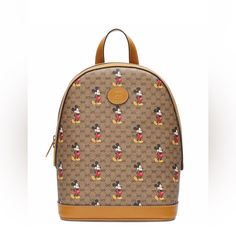 New Without Tags. Never Worn The Gucci X Disney Backpack Mini Gg Supreme Mickey Mouse Small Beige, Designed As Part Of An Animated Series, Is Made Of A Combination Of Coated Canvas And Leather. The Collaborative Backpack Is Decorated With Images Of Mickey Mouse And Colored In A Beige Color Scheme With Antique-Gold Tone Hardware. The Backpack Features Leather Tags, Both On The Outside And The Inside Fabric. Other Specifications On The Bag Include A Zip Closure, An Internal Zipper, Mobile Phone Po Images Of Mickey Mouse, Brown Disney Backpack, Cute Mickey Mouse Standard Backpack, Gucci Mickey Mouse Bag, Red Disney Minnie Mouse Backpack, Mickey Mouse Standard Backpack, Disney Backpack, Beige Color Scheme, Leather Tags