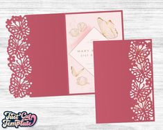 the wedding card is in pink with gold butterflies on it and has an intricate laser cut design