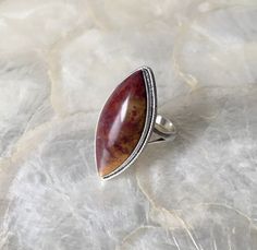 "This ring features a natural Red moss agate! The color can be described as a marbled red and yellow, creating something of an incapsulated flame. I'm more familiar with green Moss agate so I was excited to work with this! Immediately, I was drawn to this stone! The fibrous yellows and reds are contrasting yet complimenting, offering an intense and vibrant display of color! 🤤 I knew this babe was destined to be the ultimate statement ring! According to mossagategems.com some of the psychological benefits of Red Moss agate are that \"It enhances your sense of adventure and makes you free-spirited. It makes you active both physically and mentally and it makes you joyful and vibrant.\" They also mention that some of the emotional benefits include \"It makes you feel happy and positive about Handmade Jasper Rings As Gift, Handmade Jasper Rings For Gift, Handmade Jasper Rings As A Gift, Unique Jasper Rings For Gift, Jasper Gemstone Rings Gift, Jasper Gemstone Rings For Gifts, Jasper Gemstone Rings As A Gift, Gift Jasper Gemstone Rings, Healing Witch