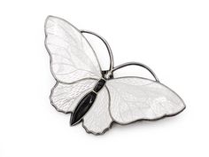 "Sweet white butterfly brooch in vermeil sterling silver and white guiloche enamel. Signed with the mark of Aksel Holmsen of Norway. Excellent vintage condition. Measurements: 1 7/8\" wide x 1\" high FREE DOMESTIC STANDARD SHIPPING Another Sky Vintage Home Page https://www.etsy.com/shop/AnotherSkyVintageLLC?ref=hdr_shop_menu PA residents will have 6% sales tax added where applicable. Other states have begun charging taxes on online purchases. Buyers will find these are added to the bill automati Luxury White Brooches As Gift, Luxury White Brooch For Gift, Luxury White Brooches For Gifts, Elegant White Enamel Pin For Gift, Formal White Enamel Pin, Formal White Enamel Pin Brooch, White Enamel Brooches As Gifts, Elegant White Enamel Pin, White Butterfly Brooches For Gifts