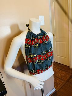 Gorgeous Kente halter top for summer days. Perfect for parties, beach and barbecue gatherings. Pair it with jeans, pants and shorts Top has adjustable strings to fit the body. Beautifully lined with a black fabric Bohemian Crop Top For Beach Days, Casual Sleeveless Halter Top For Beach Party, Multicolor Cotton Halter Top For Beach, Multicolor Cotton Halter Top For Vacation, Multicolor Cotton Halter Top For Summer, Cotton Summer Halter Top, Summer Cotton Stretch Halter Top, Summer Cotton Halter Neck Top, Stretch Cotton Summer Halter Top