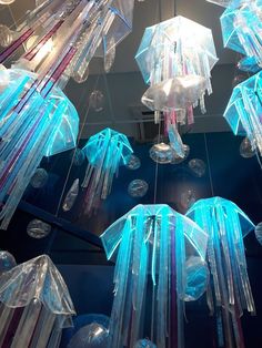 many jelly like objects are hanging from the ceiling