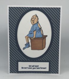 a card with an image of a man sitting in a box on top of a desk