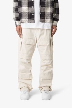 the Ultra Baggy Cargo Pants are designed with a new oversized ultra baggy fit, constructed from a ripstop fabric with a rinse wash, featuring cargo pockets throughout with snap closures, and finished with a button placket. details ultra baggy fit throughout 100% cotton extended inseam model is 6’1, 140 lbs and wears a size 30