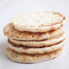 four pita breads stacked on top of each other