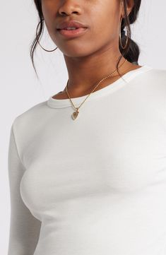 Svelte and stretchy, this finely ribbed crop top is the perfect match for high-rise styles and is polished off by a graceful scoop neckline. 17 1/2" length (size Medium)   Scoop neck   Long sleeves   97% Lenzing™ EcoVero™ viscose, 3% spandex   Lenzing EcoVero viscose is a sustainably produced fiber using pulp made from renewable wood sources and certified with the EU Ecolabel for high environmental standards, including lower emissions and water usage than generic viscose   Machine wash, dry flat Chic Ribbed Crop Top For Everyday, Elegant Ribbed Cropped Crop Top, Elegant Ribbed Cropped Top, High Stretch Scoop Neck Crop Top, Bra Friendly, Solid Scoop Neck Crop Top, Bra Friendly, Solid Stretch V-neck Crop Top, Beige Fitted Long Sleeve Crop Top, White 4-way Stretch Long Sleeve Top, High Rise Style