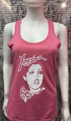 This is a pink with white ink sleeveless long X Ray Spex tank top with racer back. This has a X Ray Spex image screen printed on the front. 60% cotton/ 40% polyesterThese are handmade screenprinted and slightly vary from the photo. Please feel free to email me any questions. Thanks for looking.Due to an influx of incorrect addresses if a package is returned,  you must pay the shipping cost to resend the item to you.I do not do exchanges and I do not take returns unless the item is damaged. I tho Affordable Pink Printed Tank Top, Fitted Sleeveless Grunge T-shirt, Y2k Graphic Print Racerback Top, Y2k Racerback Top With Graphic Print, Y2k Cotton Racerback Tank Top, Y2k Style Cotton Racerback Tank Top, Summer Punk Tops With Screen Print, Summer Punk Style Screen Printed Tops, Punk Style Screen Print Tops For Summer