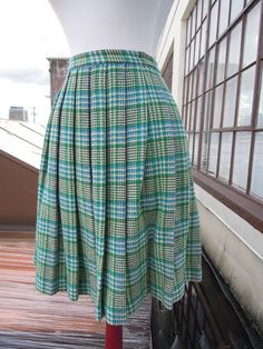 "Vintage 50's-60's perfect wool plaid pleated skirt. Main colors, are cream, teal and green. Great condition; no notable flaws. Hidden zip with button closure. Unlined. Waist:12.25\" across (24.5\" waist, a 25\" waist would be snug but it has a tiny bit of give) Length:21.25\" Hips:open (pleated)" Green Accordion Pleats Skirt, Fitted Green Accordion Pleated Skirt, Retro Green Pleated Skirt, Vintage Full Skirt With Accordion Pleats, Vintage Plaid Full Skirt, Vintage Pleated Plaid Skirt, Retro Knee-length Pleated Skirt, Vintage Fitted Accordion Pleated Skirt, Fitted Vintage Plaid Skirt