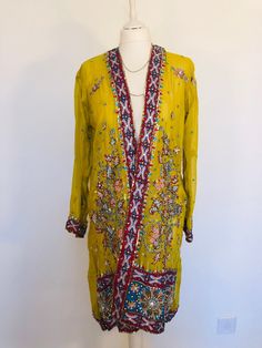 "A Stunning Boho Jacket , handmade from a Vintage Indian Sari. so a complete one of a kind. A Wonderfully Chic and Flattering Golden Ochre Silk Chiffon Jacket, Beautifully embellished allover with an exquisite design in layers of contrasting Red,Turquiose and Silver. The jacket is decorated with 1000's of Sparkling Silver and Gold Sequins,Shimmering bugle beads,Hand embroidery and Diamante Crystals that all Glitter and catch the Light . This Lovely piece is truly unique ,and will look stunning d Silk Outerwear With Zari Work And Long Sleeves, Festive Long Sleeve Silk Outerwear, Traditional Embellished Spring Outerwear, Traditional Embroidered Outerwear For Parties, Festive Embroidered Outerwear For Party, Festive Embroidered Party Outerwear, Traditional Fitted Embellished Outerwear, Bohemian Outerwear For Festive Wedding, Traditional Fitted Evening Outerwear