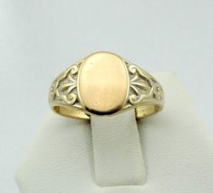 "Solid 14K yellow gold signet ring ready for your engraved initials. Marked 14K. Not engraved. A wonderful addition to your personal jewelry collection. FREE SHIPPING! Details: 14K Yellow Gold: (as shown in picture) Ring Size: 7 3/4 Total Weight: 4.3 grams FREE domestic shipping by USPS Priority Mail delivery confirmation and includes insurance. If the item is to be shipped internationally Etsy will calculate postage. Please notify us at purchase if you are buying more than one item and we will Luxury Victorian Signet Ring With Gemstone, Luxury Vintage Signet Ring With Center Stone, Luxury Engraved Victorian Signet Ring, Gold Etched 14k Gold Signet Ring, Etched 14k Gold Signet Ring, Classic Gold Etched Signet Ring, Formal Oval Engraved Ring With Etched Details, Heirloom Etched Signet Ring For Formal Occasions, Formal Heirloom Etched Signet Ring