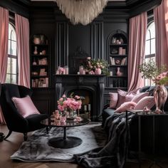 a living room filled with black furniture and pink curtains