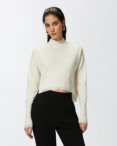 High-neck sweater in pristine white knit cashmere-blend fabric with metallic-effect edging created by special thread worked into the material. The slim fit of this mock-neck sweater is accompanied by slightly low set-in long sleeves with long cuff. Figure-flattering when worn, this slightly short sweater gives everyday looks with trousers or high-waisted skirts the perfect finish. Waisted Skirts, White Turtleneck Sweater, Short Sweater, Calf Length Skirts, White Turtleneck, High Neck Sweater, Casual Blazer, Mid Length Dresses, Mock Neck Sweater