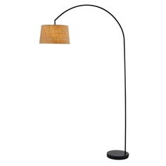 a black floor lamp with an orange shade on it's side and a white background