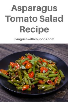 asparagus tomato salad recipe on a black plate with text overlay that reads, asparagus tomato salad recipe