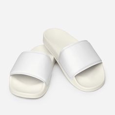 These Men’s Slides are perfect for enjoying the day at the beach or pool.  The cushioned upper strap will keep the feet in place, and the textured footbed will guarantee comfort while the wearer’s too busy having fun by the water.  Offer this summer essential shoe to customers online or get your hands on a pair of your own. Cushioned faux leather upper strap. Lightweight polyurethane (PU) outsole. Contoured, textured footbed. Stitched around the upper perimeter for extra durability. Spot clean o Lightweight White Slip-on Slides, Foam Slides With Rubber Sole And Round Toe, Foam Slides With Round Toe And Rubber Sole, Comfortable Non-slip Foam Flip Flops, White Slide Flip Flops For Leisure, Non-slip Foam Slides With Open Toe, White Synthetic Sport Sandals For Beach Season, White Flip Flops For Leisure In Summer, Comfortable Non-slip White Sandals