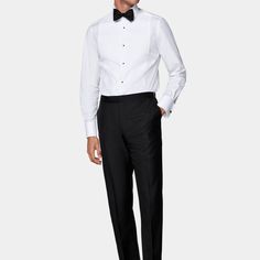 These black tuxedo trousers are tailored to a slim leg fit, offering a sleek and modern silhouette. Featuring a flat front and side adjusters for a refined appearance. Semi-formal Tuxedo Pants With Pressed Crease, Fitted Timeless Formal Dress Pants, Timeless Fitted Formal Dress Pants, Fitted Timeless Dress Pants For Formal Occasions, Tailored Tuxedo Dress Pants For Semi-formal Occasions, Classic Tailored Bottoms For Black-tie Events, Tailored Classic Bottoms For Black-tie Events, Classic Fitted Pants For Black-tie Events, Elegant Formal Dress Pants With Flat Front