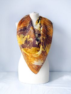 Big scarf Autumn Leaves is a square scarf made of Habotai Light in brown and yellow - gold colors. This hand painted silk scarf is covered in golden autumn leaves and branches on a warm brown background. Size: approximately 35 by 35 in (90 by 90 cm). Would you like to order it in oblong shape? How about 63 by 17 inches scarf: https://www.etsy.com/minkulul/listing/241652496 Silk: natural Habotai Light, which has lovely glow and partly - transparent quality. It's very delicate scarf in yellow and Brown Square Silk Scarf Gift, Brown Silk Scarves For Fall, Bohemian Brown Silk Scarf For Fall, Painted Silk Scarves, Batik Painting, Autumn Scarf, Silk Scarfs, Scarf Autumn, Leaf Scarf