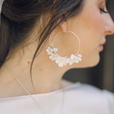 A stunning pair of handcrafted Cherry Blossom floral bridal hoop earrings , with tiny subtle Swarovski crystal stamen centres.  Each flower is intricately handcrafted and wired with delicate crystal.  The perfect feminine, statement wedding earrings to complete your bridal look. Available in 14k gold filled hoops or Sterling silver please select your required finish prior to checking out. These bridal earrings are perfect for city weddings, relaxed boho style weddings and are perfect to wear lon Delicate White Hoop Earrings For Wedding, Small White Hoop Earrings For Wedding, Delicate Small Hoop Earrings, Delicate Silver Jewelry With Handmade Flowers, Delicate Handmade Dangle Jewelry With Flowers, Delicate Handmade Flower Dangle Jewelry, Delicate Silver Flower Earrings For Wedding, Delicate Flower Hoop Earrings For Weddings, Small Hoop Flower Earrings For Wedding