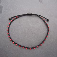 "♡Listing is for one dainty seed bead bracelet or anklet as featured and your choice of card♡ Perfect for everyday wear. Super dainty and minimalist look. Great way to add a little color to any outfit. Makes a very dainty stacking bracelet too. *Featured: Cord color- Black Beads- Red Closure- B. No Beads *Material: Item is made with sturdy nylon cord. The cord resembles silk and color will not fade away. Tiny glass seed beads are carefully hand braided as the highlight of this item. *Card: A pos Dainty Handmade Adjustable Anklets, Handmade Dainty Adjustable Anklets, Handmade Adjustable Dainty Anklets, Minimalist Handmade Anklet As Gift, Minimalist Handmade Anklet For Gift, Handmade Minimalist Anklet For Gift, Handmade Adjustable Anklets With Round Beads, Adjustable Beaded Anklet As A Gift, Adjustable Red Anklets With Round Beads