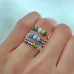 FOR MORE COLORS GO TO SHOP!! This set of three handmade wire, beaded fidget rings are perfect for any occasion and can be used in many ways. This set of bead spinner rings can serve as anti anxiety rings, focus rings for ADHD, worry rings, stress rings, or simply just cute, dainty, fashionable rings that can add a pop of color to your ensemble. The rings are constructed out of tarnish resistant wire in three available colors, and glass beads that are all unique in their special way! One order of this listing will supply three rings of your choosing. Simply let me know what bead combination you'd like with their respectful band color of SILVER, GOLD, or ROSE-GOLD. If you don't know what your ring size is, thats okay! There are plenty of ways to find out, but the benefit of this ring set, is Fashionable Rings, Bead Spinner, Fidget Jewelry, Diy Elastic, Elastic Rings, Worry Ring, Fidget Rings, Three Rings, Booth Ideas