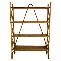 a bamboo shelf with three shelves on each side and one shelf holding two bookshelves