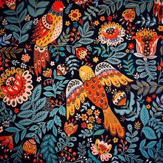 an image of birds and flowers on a black background with red, orange, yellow, blue colors